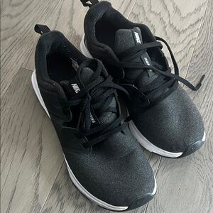 Women’s size 7.5 Nike Black and White tennis shoes